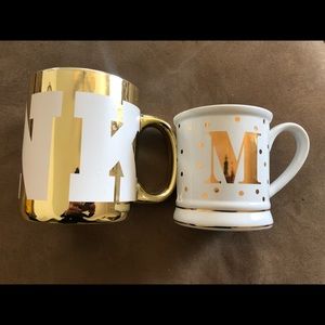 2 mugs , 1 is PINK , 1 is Initial M